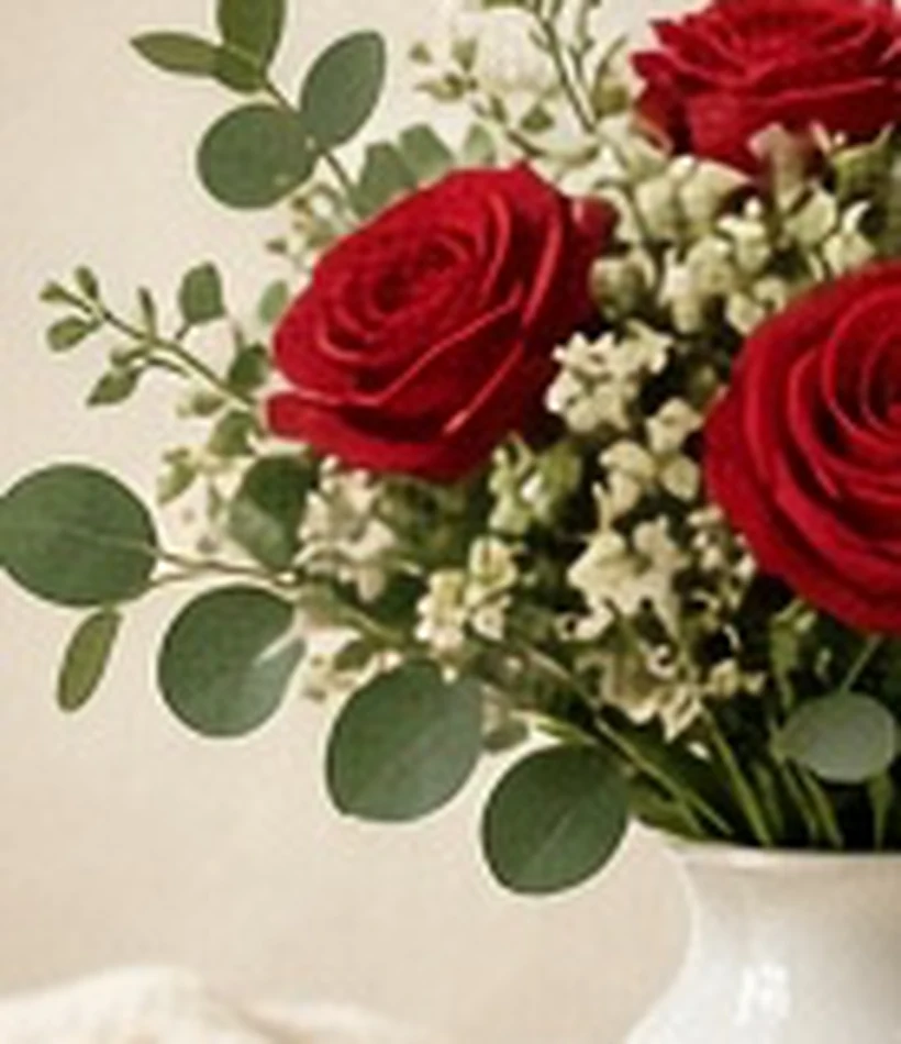 Close-up of a red rose bouquet on a table